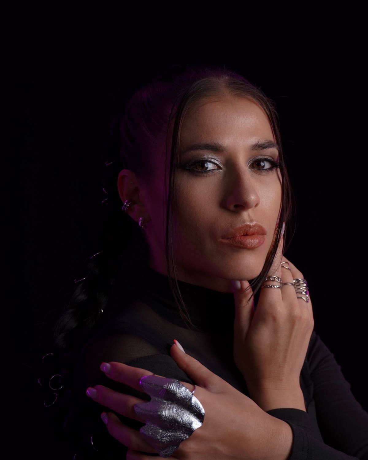 Close portrait of Yana, dark makeup and a silver ring